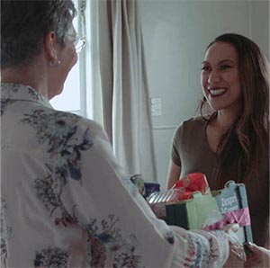 Woman-delivers-emergency-food-parcel-to-CAP-Debt-Help-Client Woman delivers emergency food parcel to CAP Debt help Client
