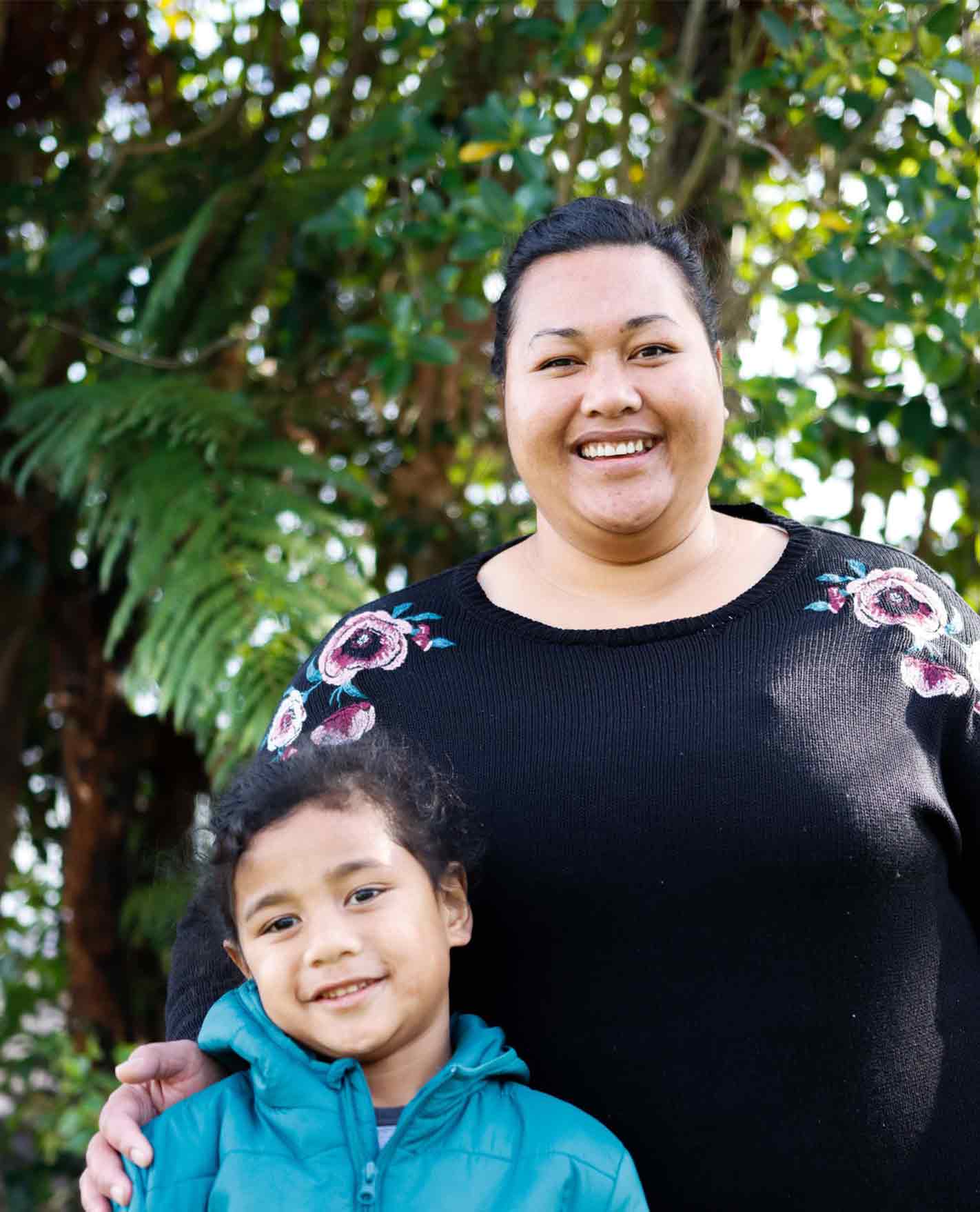 Mel and her son, smiling