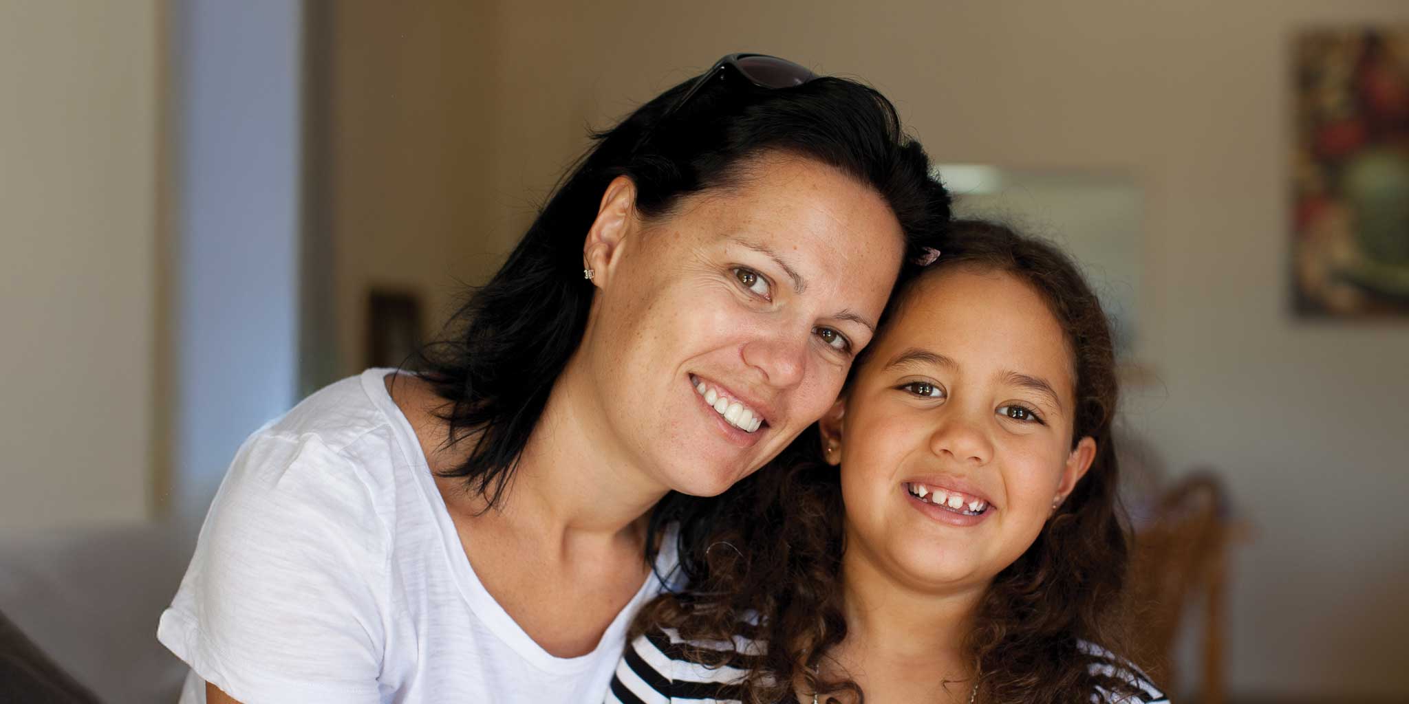 CAP Client debt-free and happy with her daughter